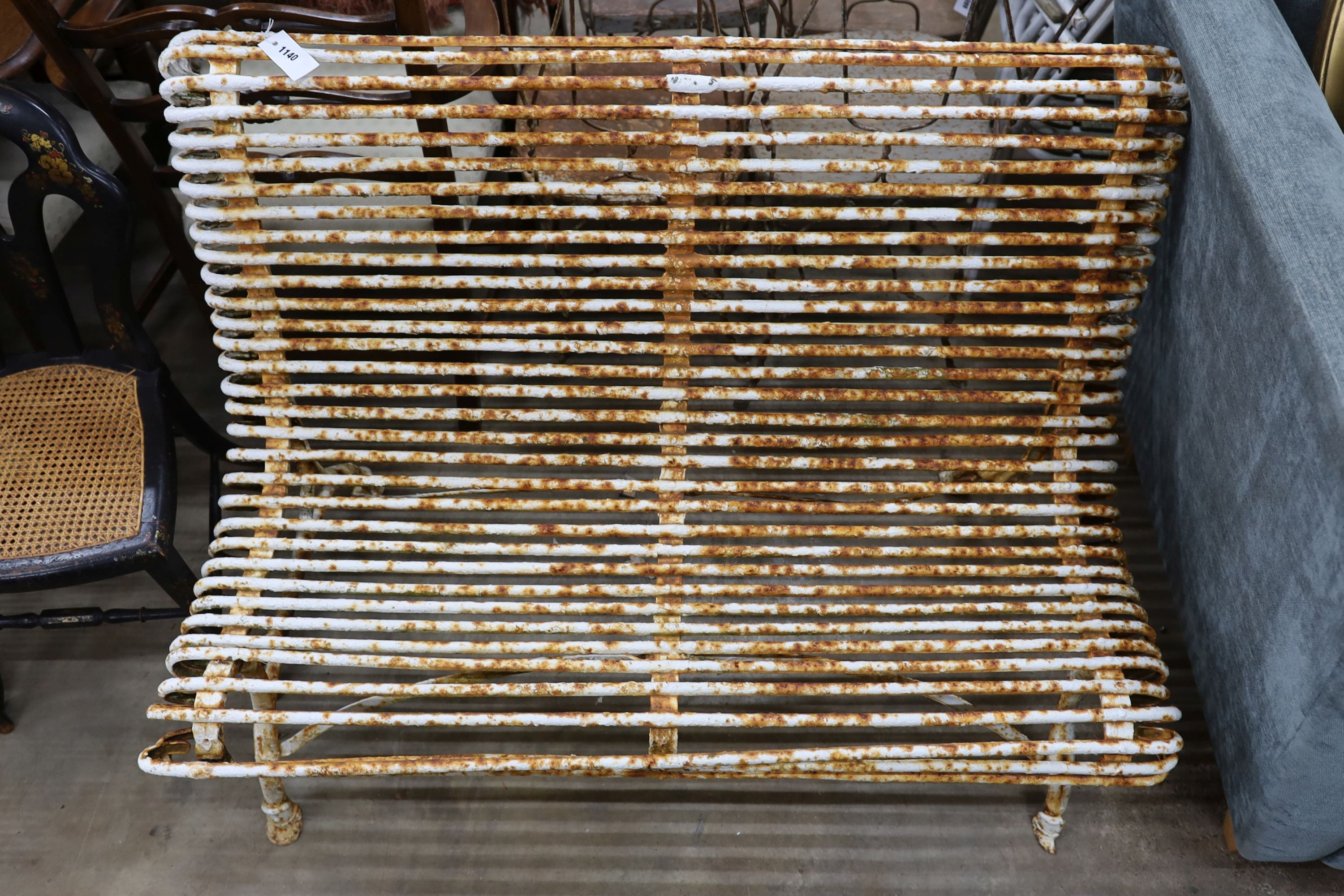 A painted wrought iron Aras bench, length 118cm, depth 66cm, height 83cm